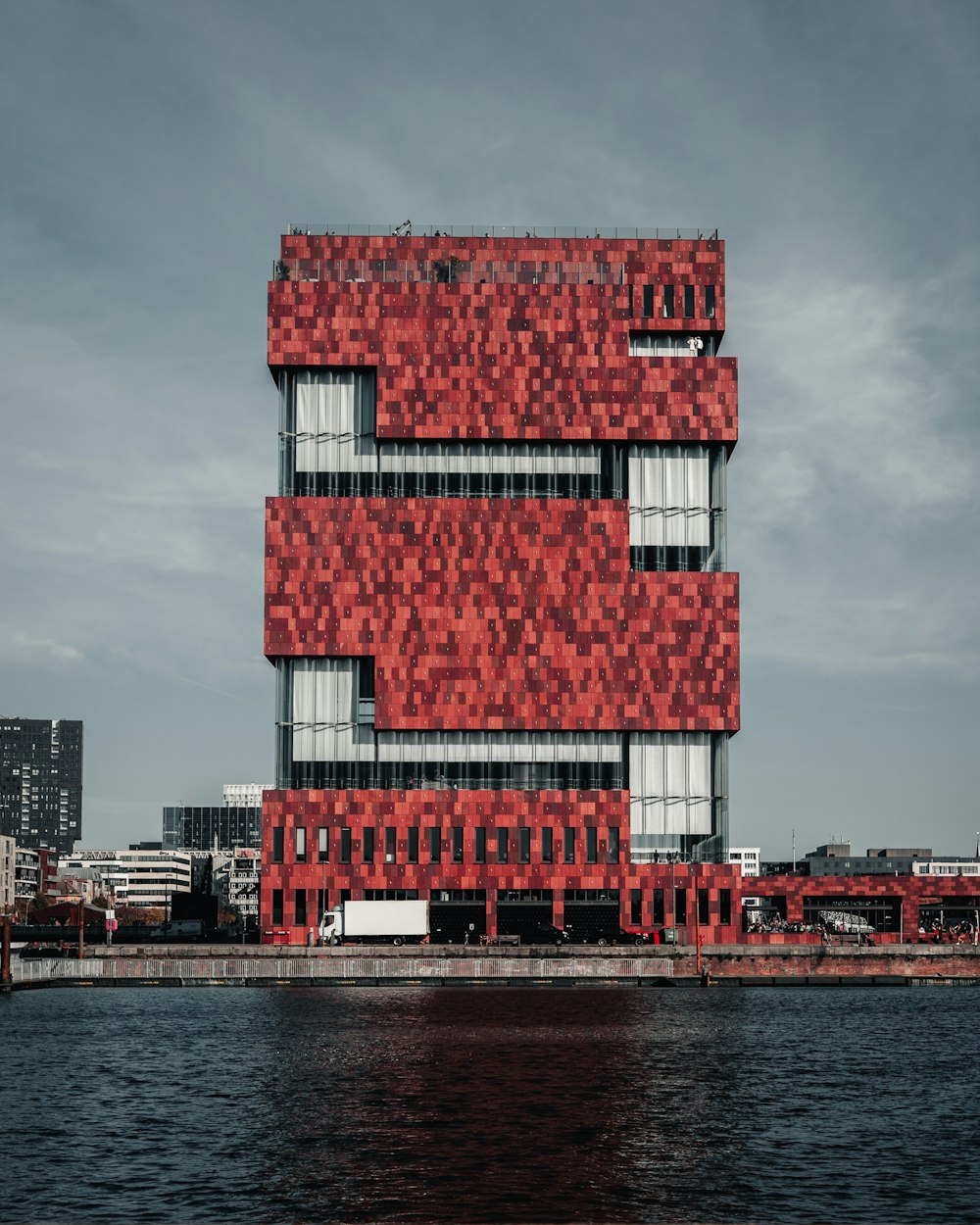 red and white concrete building near sea