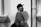 man standing beside wall