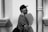 man standing beside wall