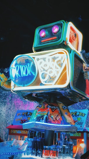 A vibrant neon-lit robot mascot striking a playful pose with glitch effects around it.