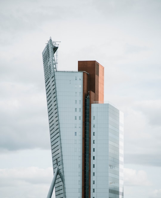 white concrete building during daytime in Rotterdam Zuid railway station Netherlands