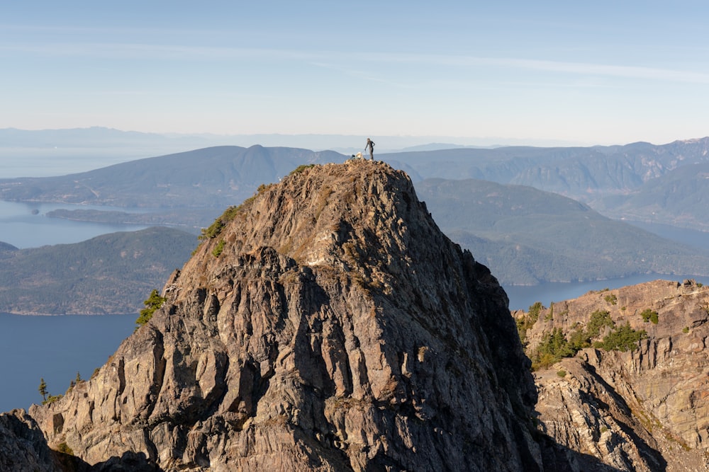 person standing on top of mountain