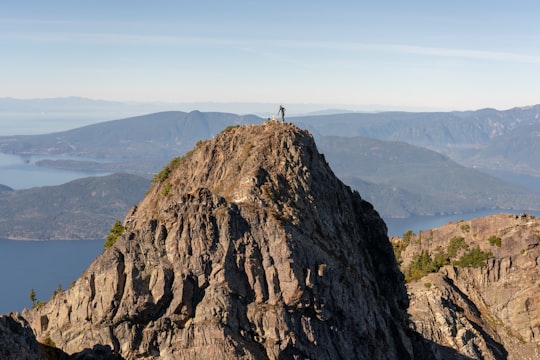 person standing on top of mountain in Lions Bay Canada