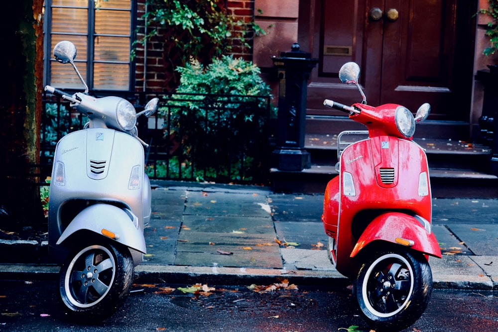 white and red motor scooters parked side-by-side