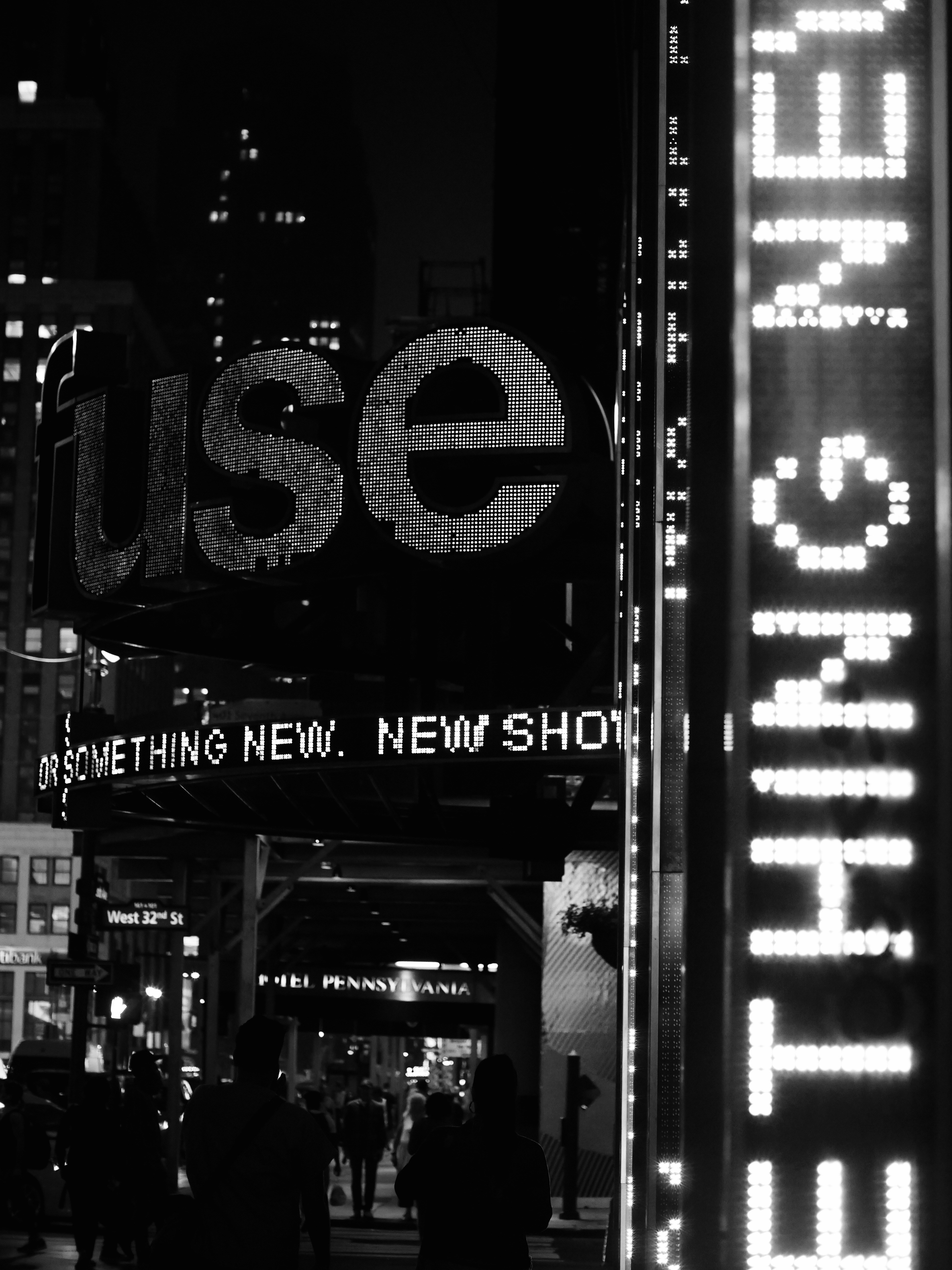 a black and white photo of a street sign
