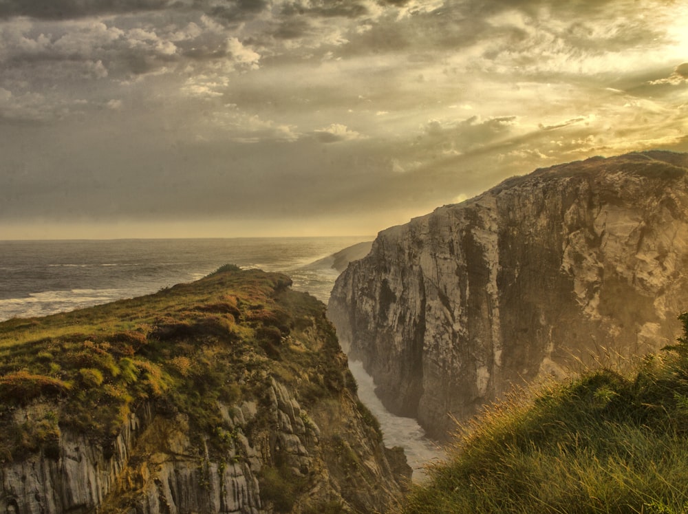 mountain beside ocean