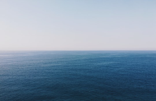 body of water under teal sky in Buljarica Montenegro