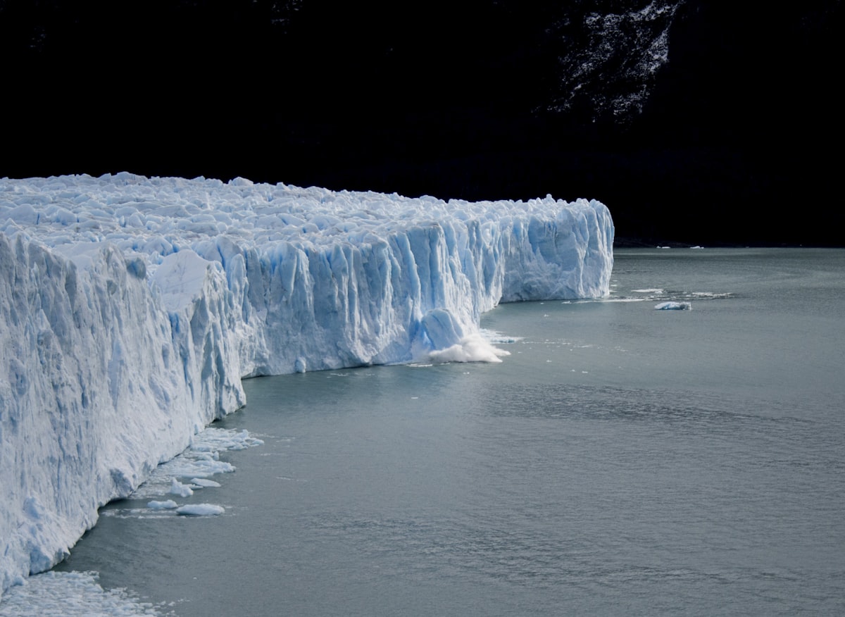 An iceberg showing its mass both above and below the waterline