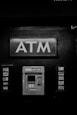 grayscale photo of ATM machine