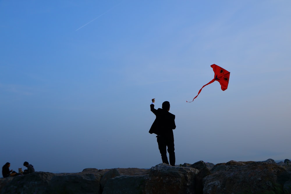 man playing red kite