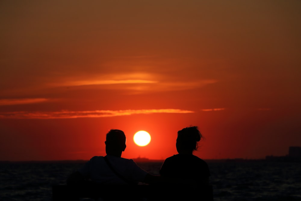 man and woman silhouette photography