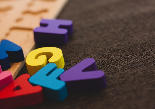 alphabet learning toy on gray apparel