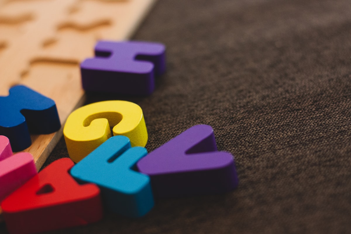 Colorful wooden puzzle pieces and shapes