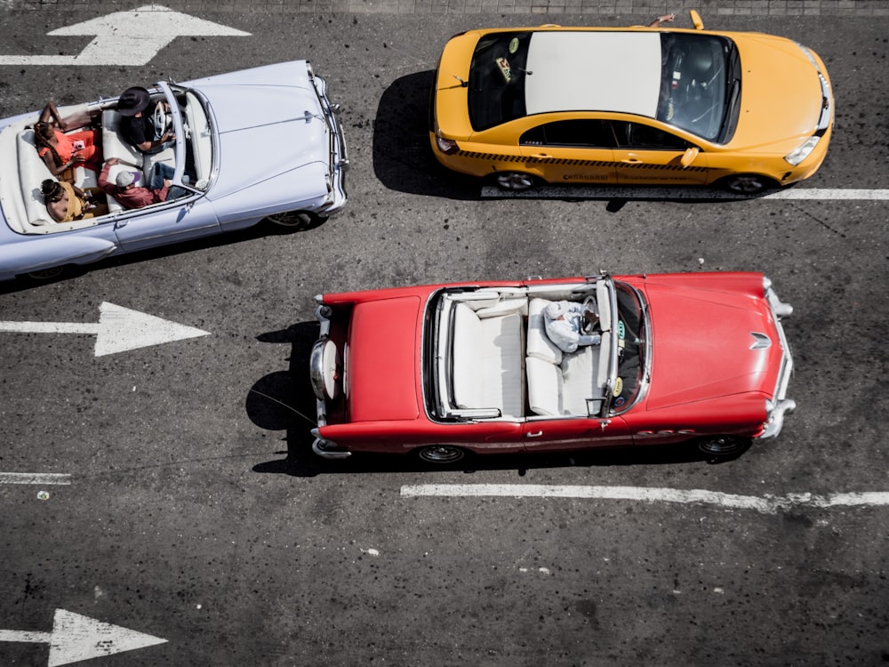 three cars on road