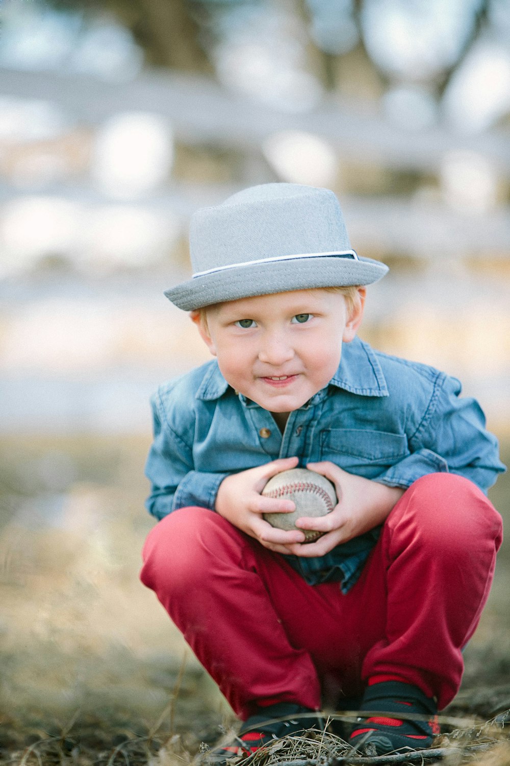 boy holding baseball