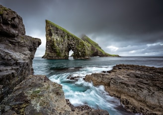 rock formation on body of water