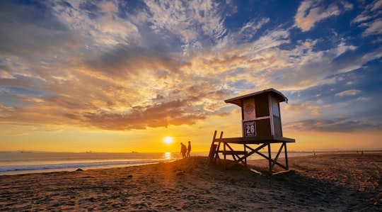 people on seashore near house in Sunset Beach United States