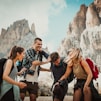 low-angle photography of two men playing beside two women