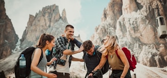 low-angle photography of two men playing beside two women