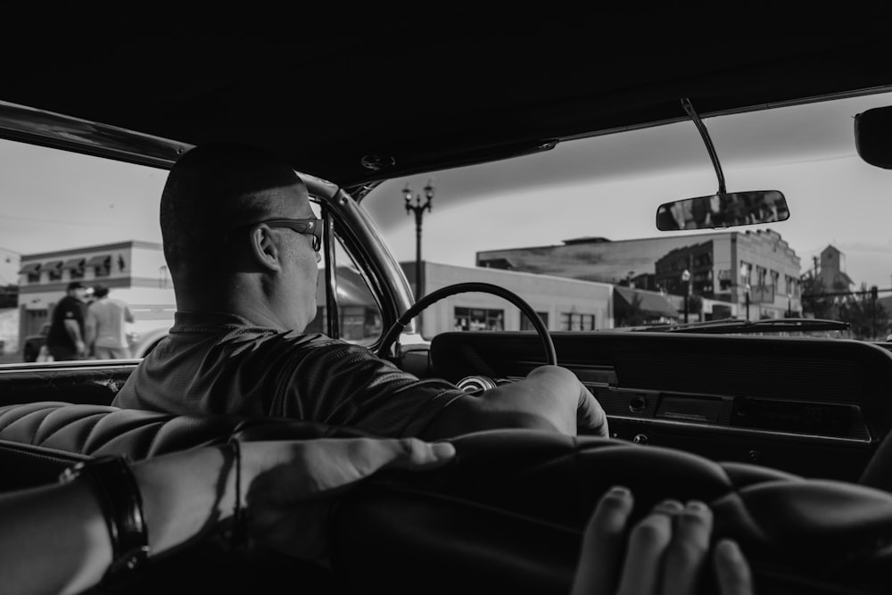 man in steering wheel