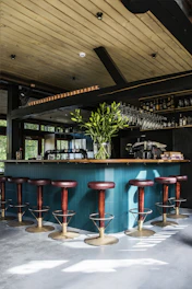 empty bar chairs during daytime