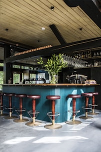 empty bar chairs during daytime