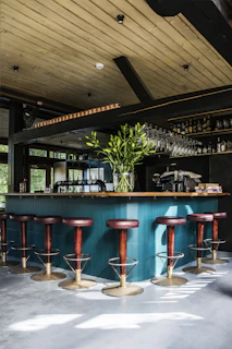 empty bar chairs during daytime