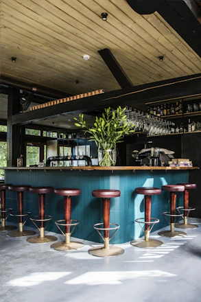 empty bar chairs during daytime