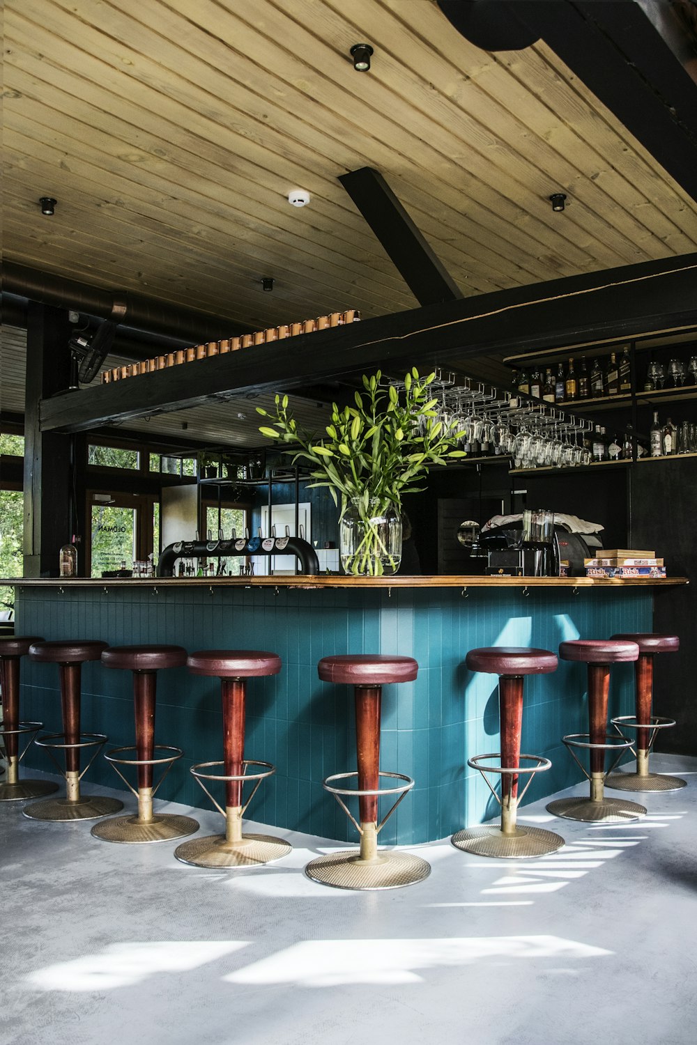 empty bar chairs during daytime