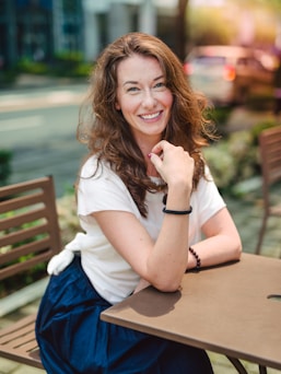 woman sitting in front of the dining table