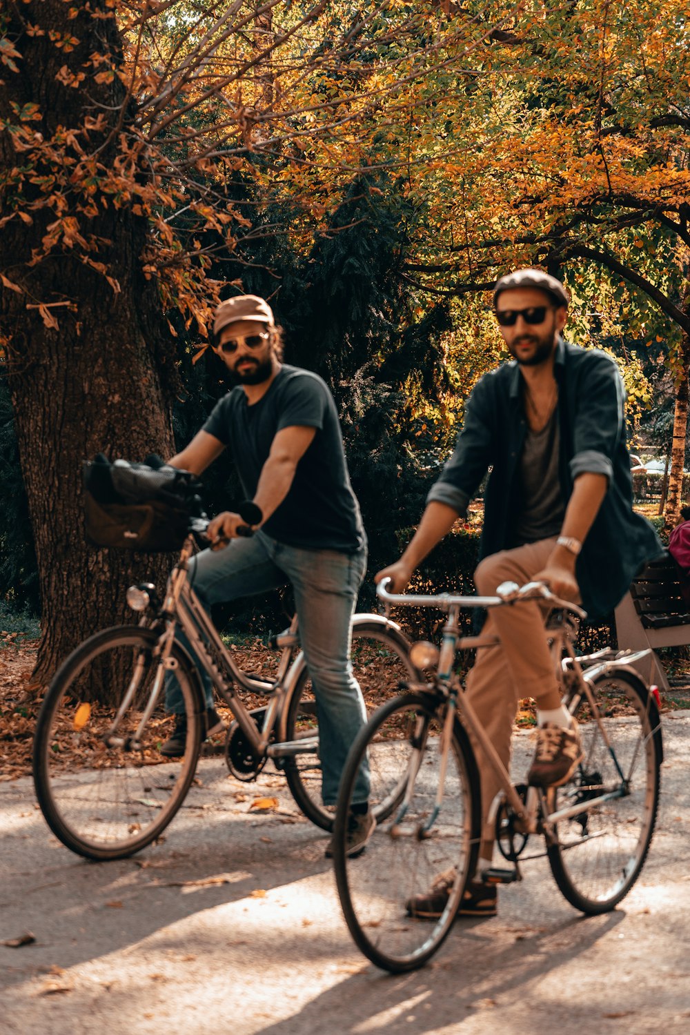 two men riding bicycle during daytime