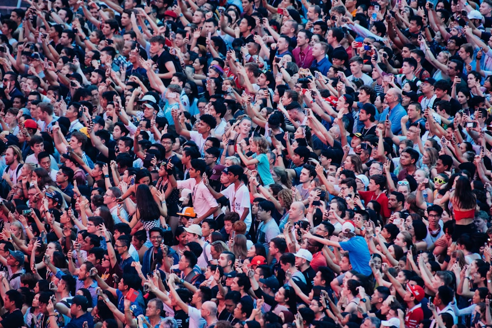 a large group of people standing next to each other