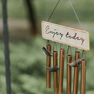 brown and gray wine chime with enjoy today text