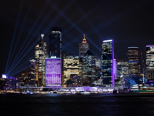 A vibrant night view of Nashville, Tennessee showcasing its illuminated buildings.