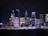 A vibrant night view of Nashville, Tennessee, showcasing illuminated buildings.