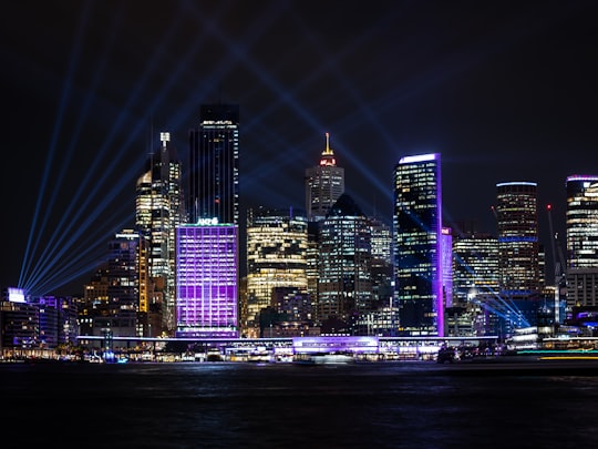 purple lights through high rise buildings in Bradfield Park Australia