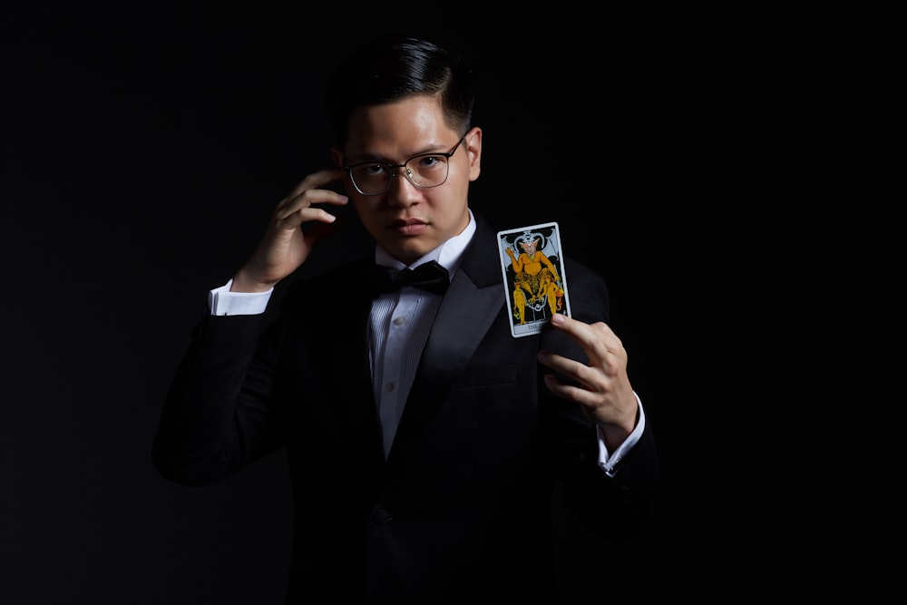 man holding card on focus photography