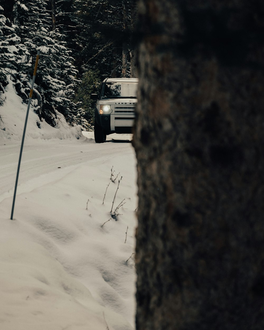 SUV on road covered with snow