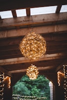 Evening scene with warm lights under a pergola, creating an inviting atmosphere for outdoor dining.
