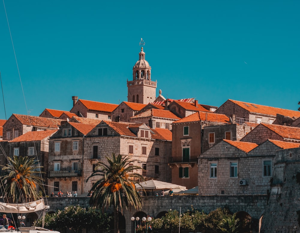 red roof concrete houses under clear blue sky