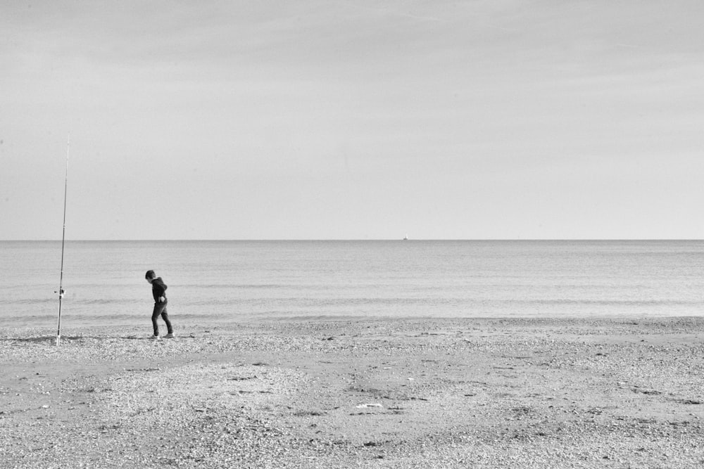 man standing on seashore