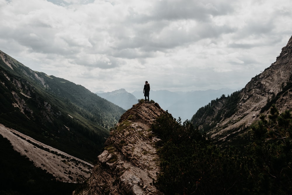 a person standing on top of a mountain