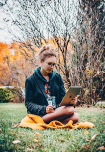 woman holding iPad