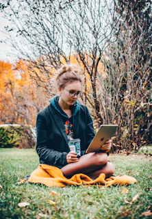 woman holding iPad