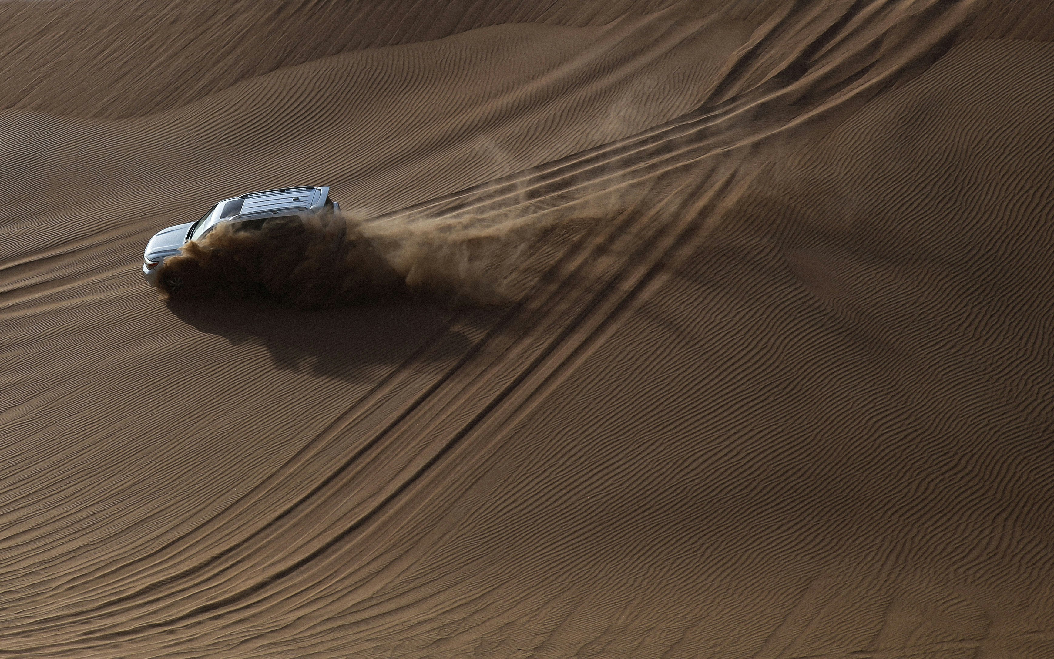 white SUV on desert