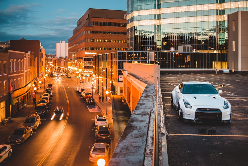 white Nissan GTR parked on building's roof