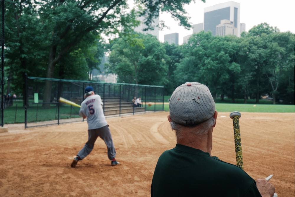 man holding baseball bat