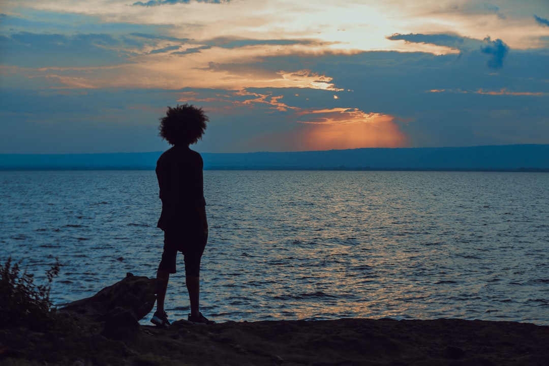 man standing near shore