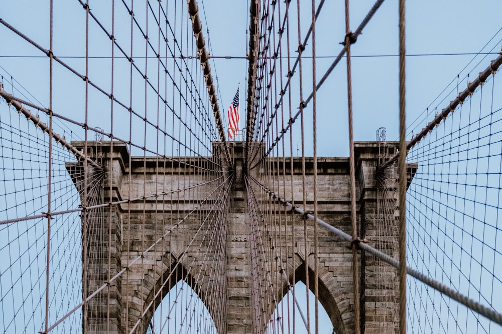 USA flag on Brooklyn Bridge during daytime