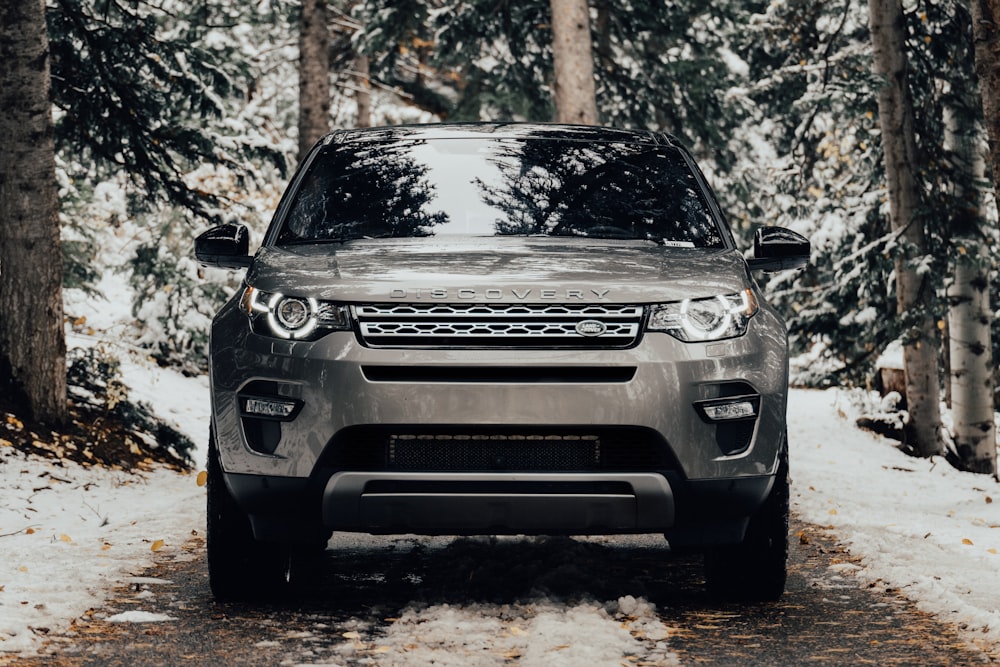 grey Land Rover vehicle on pathway